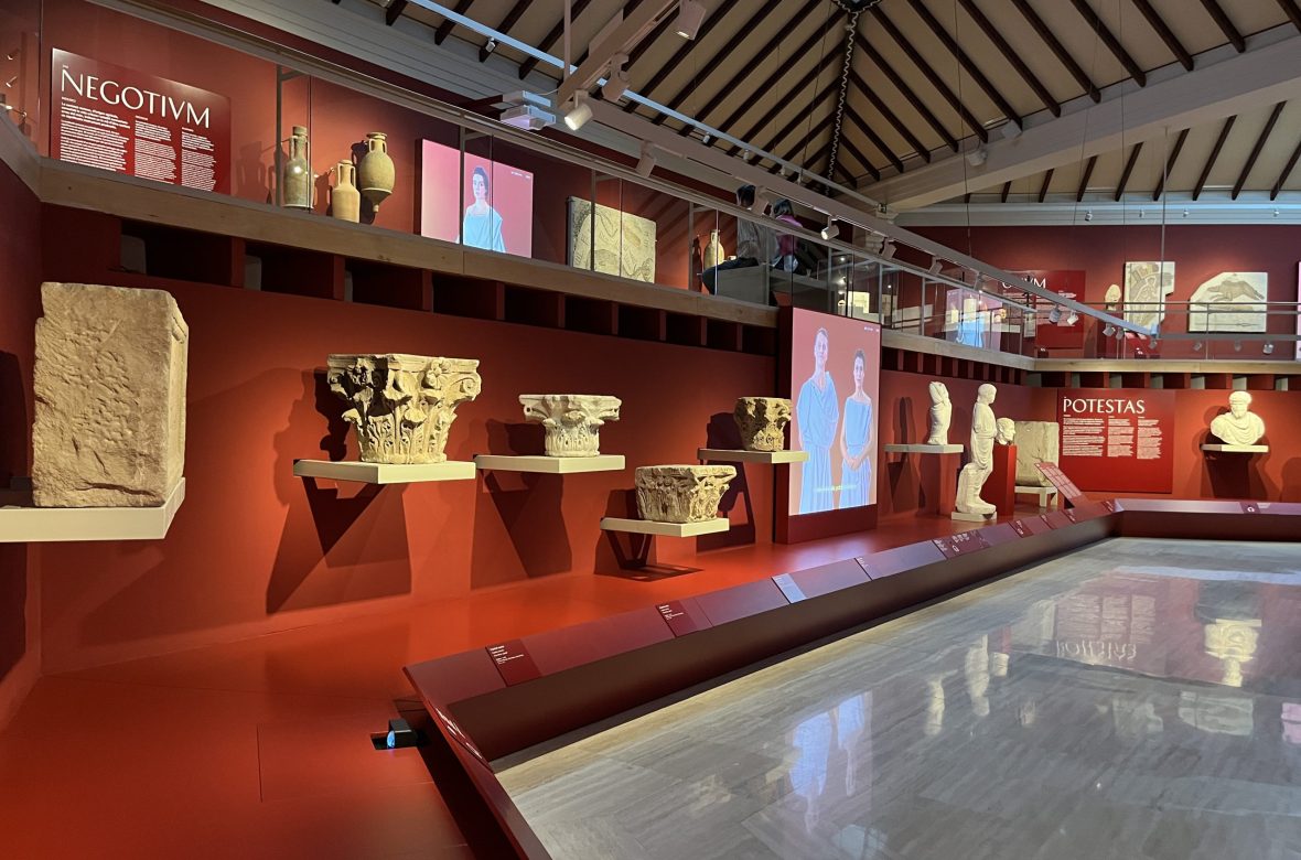 Ancient ceramic artifacts displayed on museum shelf