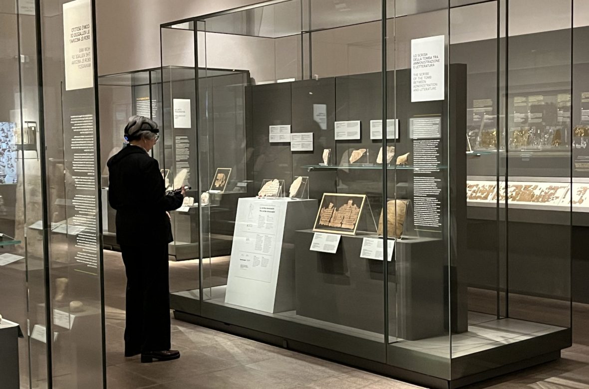 Visitor exploring the scribe collection at Museo Egizio in Turin